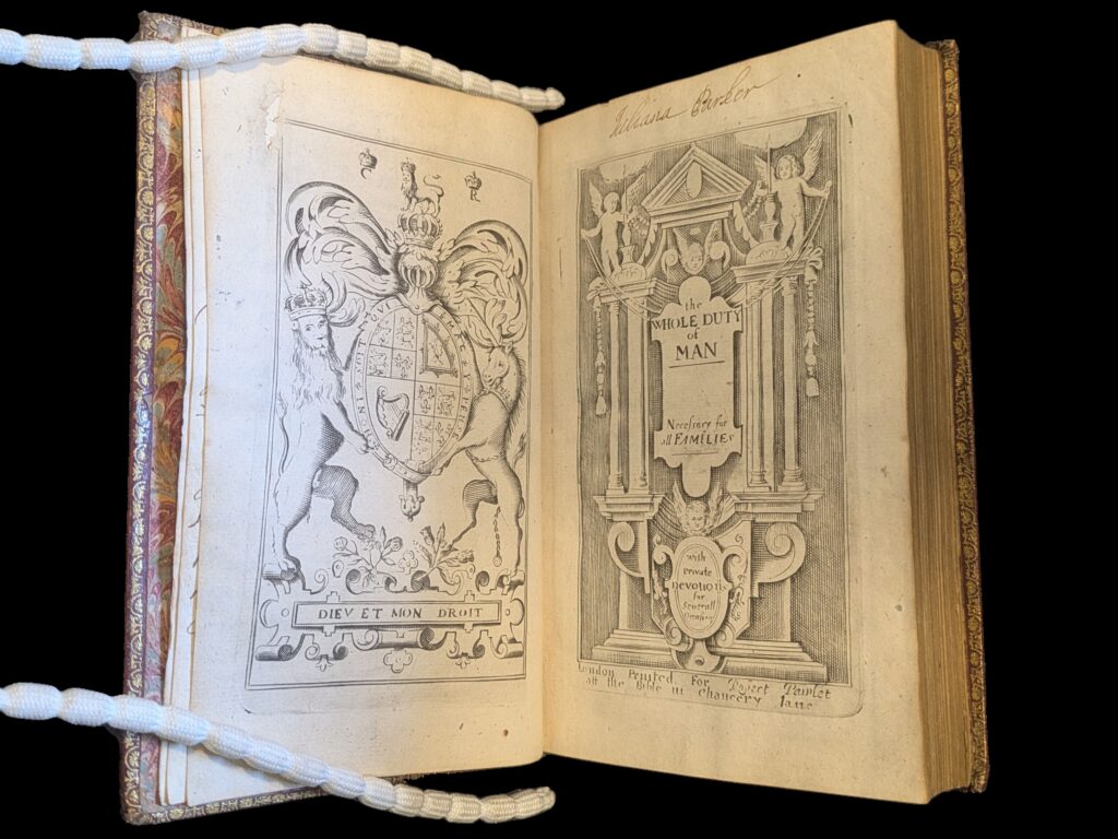 Book open to illustrated frontispiece with royal coat of arms of James II on left page. On right page is engraviing of the title 'The whole Duty of Man' surrounded by angels on decorative columns.