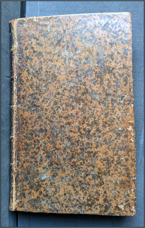 Mottled front cover of a book