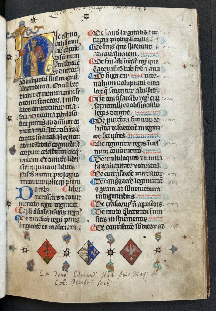 Hertford MS 2 f1r. First page of manuscript with gold illuminated initial and Latin text in black, blue and red ink. 