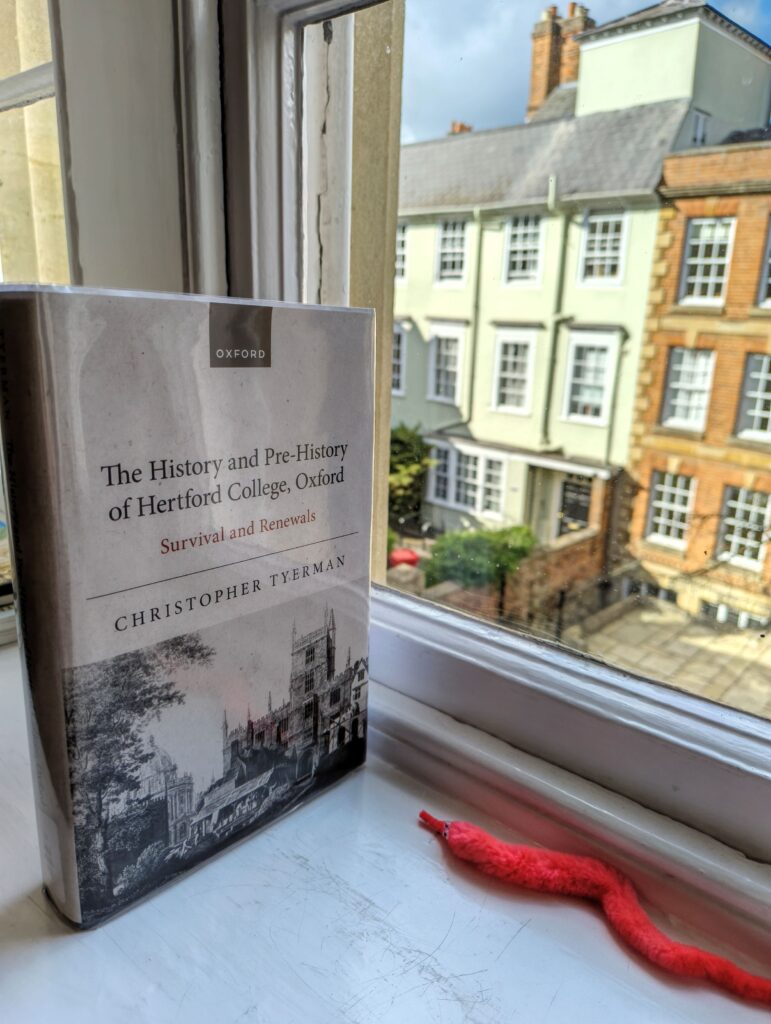 Tyerman's book The History and Pre-History of Hertford College on a windowsill with New College Lane in the background
